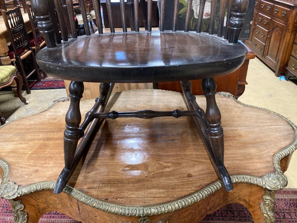 A Windsor beech rocking chair, width 59cm, depth 45cm, height 106cm